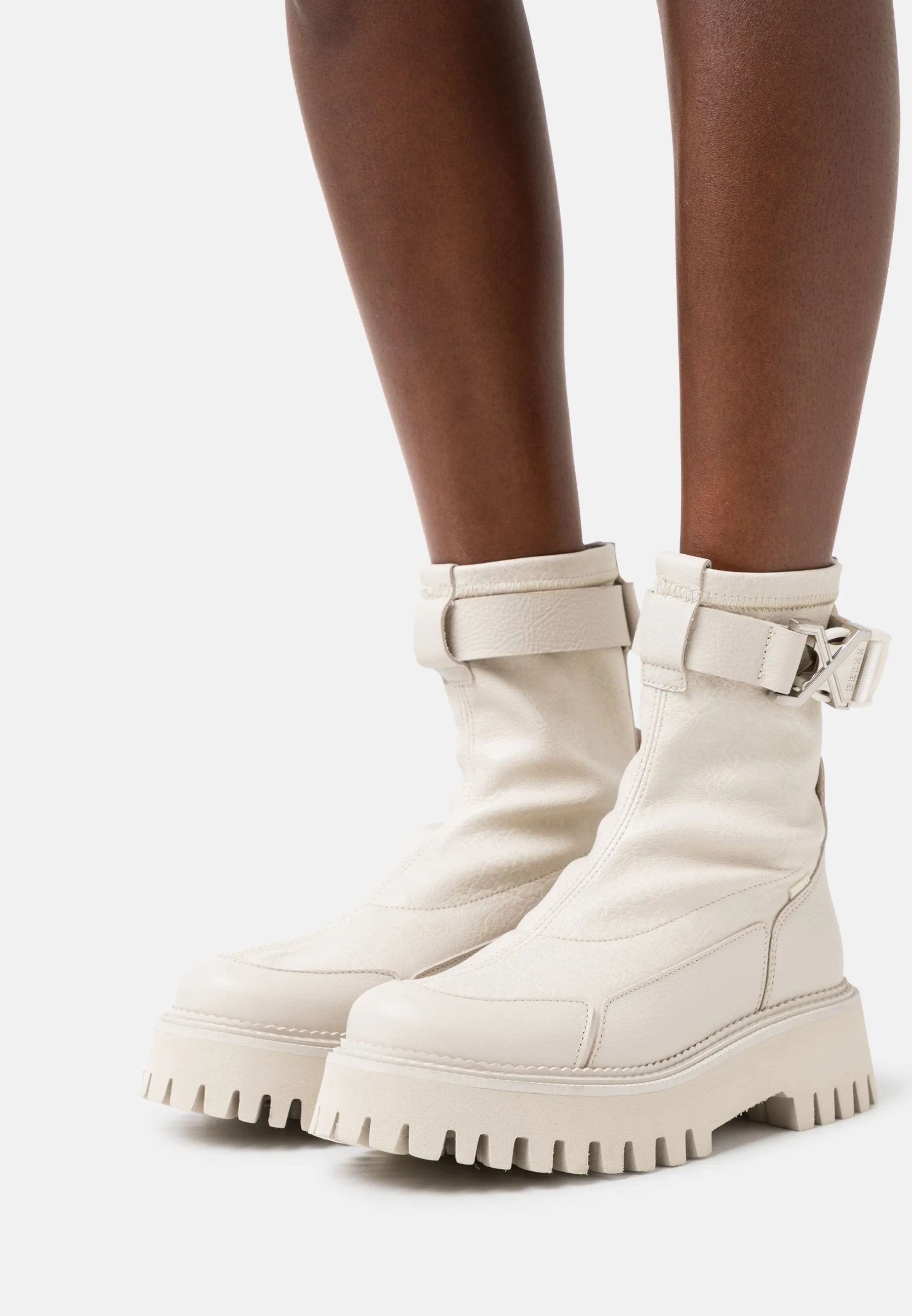 Groovy Stretch Buckle White Ankle Boots