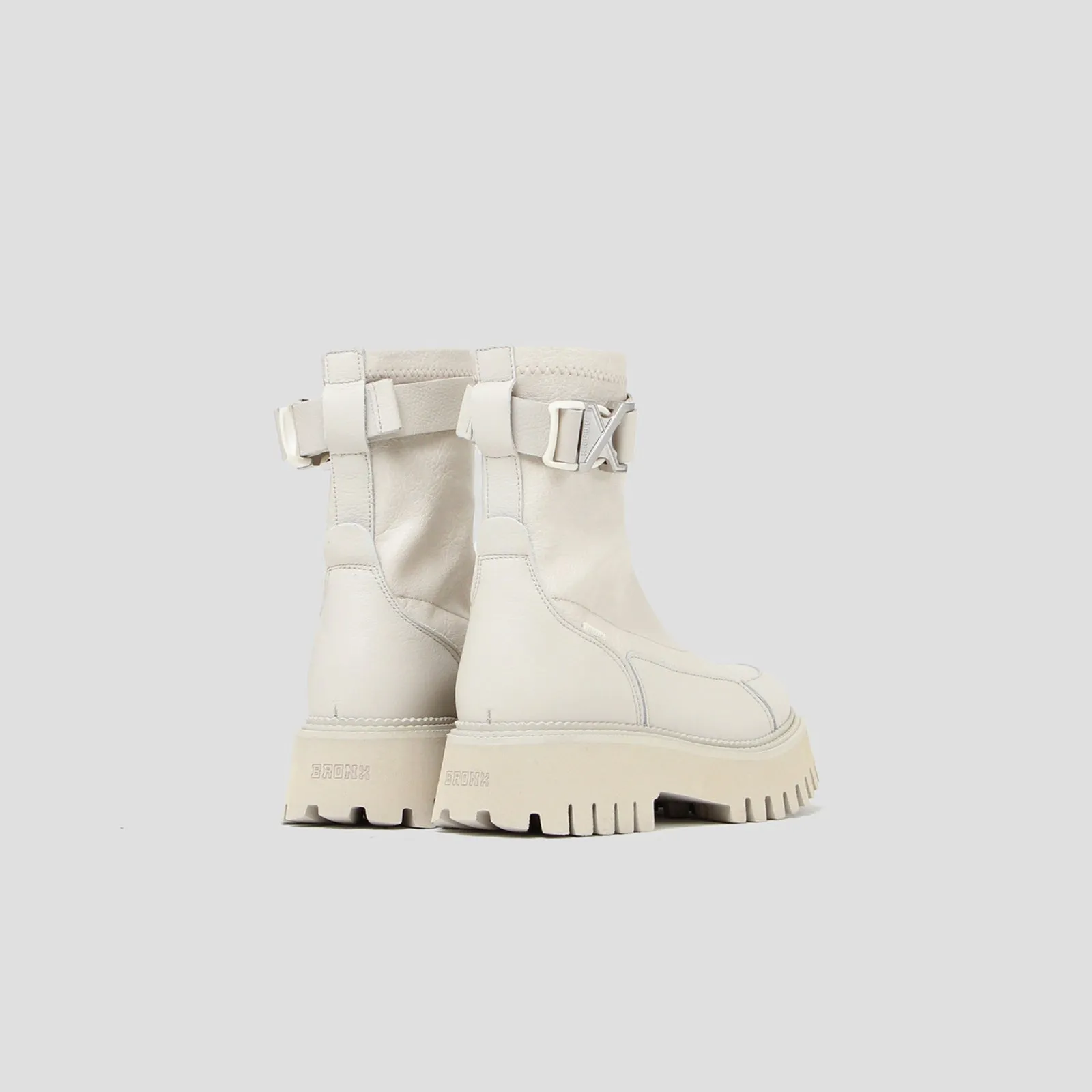 Groovy Stretch Buckle White Ankle Boots